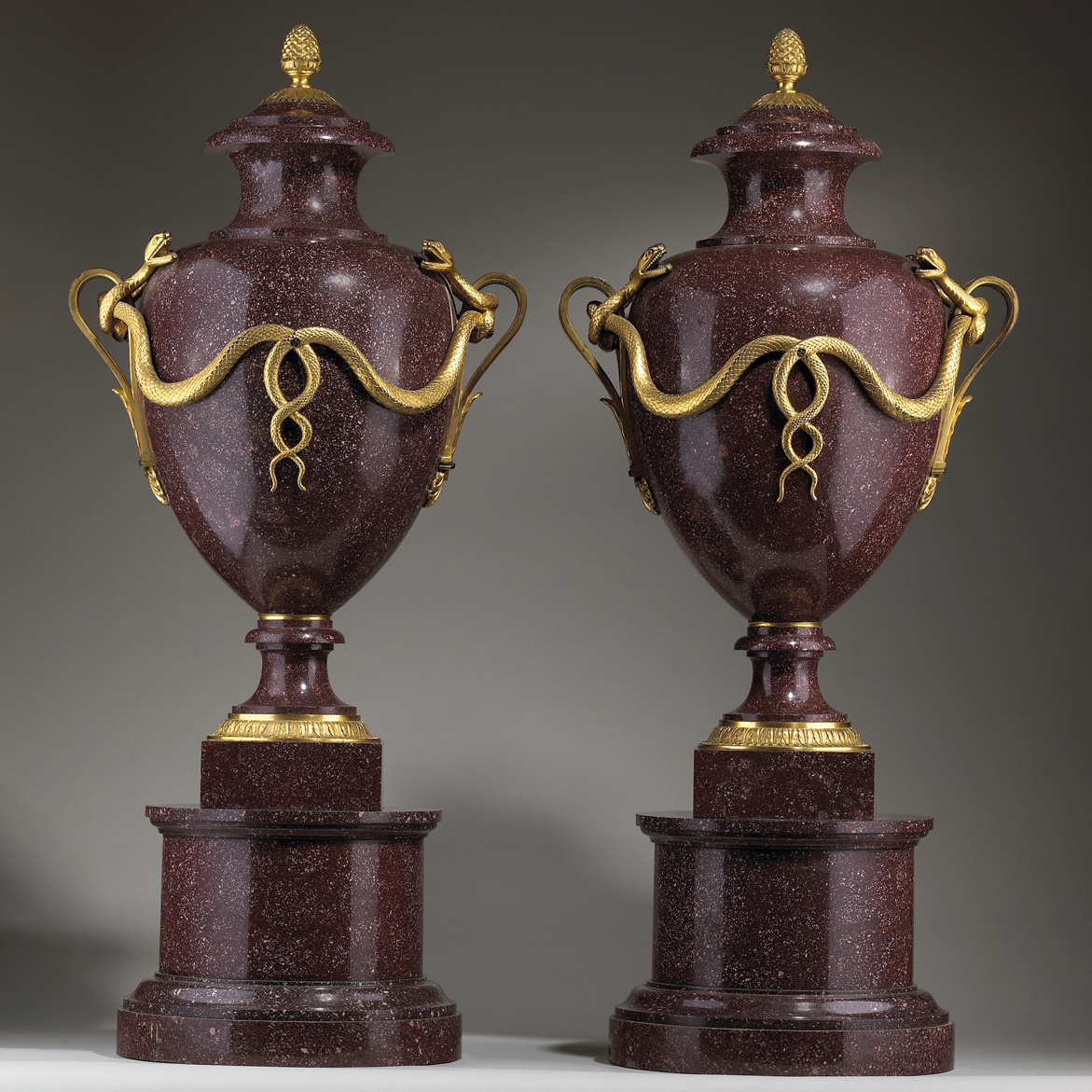 A Pair of Ormolu-mounted Imperial Porphyry Urns and Covers on Stands
